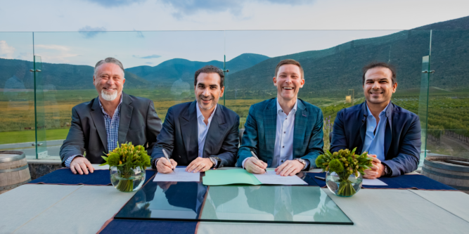 Cone and AM leadership signing aquisition documents